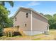 Exterior view of home showcasing a deck, siding, and well-maintained yard at 222 Ventner Ct, Charlotte, NC 28214