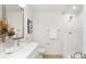 Bathroom featuring a modern vanity, glass enclosed shower, and bright lighting at 222 Ventner Ct, Charlotte, NC 28214