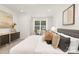 A modern primary bedroom featuring carpeted floors, a sitting area, and lots of natural light at 222 Ventner Ct, Charlotte, NC 28214
