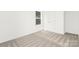An empty bedroom with neutral carpet, white walls, a double closet, and a window at 222 Ventner Ct, Charlotte, NC 28214