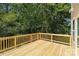 Wood deck provides a peaceful outdoor space surrounded by lush greenery at 222 Ventner Ct, Charlotte, NC 28214