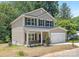 Charming two-story home with a front porch, two-car garage and brick accents at 222 Ventner Ct, Charlotte, NC 28214