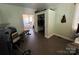 Cozy bedroom with an ensuite bathroom and closet space; featuring tile floors and muted green walls at 228 Hazeleen Ave, Belmont, NC 28012