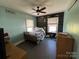 Cozy bedroom with unique decor, natural light, and functional layout at 228 Hazeleen Ave, Belmont, NC 28012