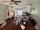 Spacious dining room with a large table, pendant lighting, and seamless flow to kitchen at 228 Hazeleen Ave, Belmont, NC 28012