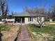 Charming single-story home with a welcoming front porch and landscaped front yard on a sunny day at 228 Hazeleen Ave, Belmont, NC 28012