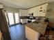 Modern kitchen with granite countertops, stainless steel appliances, and stylish white cabinetry at 228 Hazeleen Ave, Belmont, NC 28012