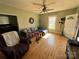 Inviting living room with hardwood floors, comfortable seating, and natural light streaming through the window at 228 Hazeleen Ave, Belmont, NC 28012