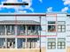 A close exterior shot shows a covered balcony with chairs and tables at 2401 Euclid Ave # 306, Charlotte, NC 28203