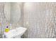 Chic powder room featuring patterned wallpaper, a stylish sink, and modern fixtures at 2401 Euclid Ave # 306, Charlotte, NC 28203