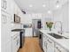 Lovely kitchen featuring white cabinets, quartz counters, stainless steel appliances, and a stylish subway tile backsplash at 2401 Euclid Ave # 306, Charlotte, NC 28203