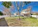 Expansive backyard featuring a white fence, mature trees, and a patio with outdoor furniture, perfect for relaxation and entertaining at 249 Sand Paver Way, Fort Mill, SC 29708