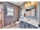 Bathroom features a gray vanity with a white sink, decorative floors, and patterned shower curtain at 249 Sand Paver Way, Fort Mill, SC 29708
