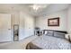 Bedroom featuring a full bed, large mirror, neutral decor, and lots of closet space at 249 Sand Paver Way, Fort Mill, SC 29708