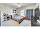 Bedroom with a full bed, large window, and sports-themed lockers and decor at 249 Sand Paver Way, Fort Mill, SC 29708