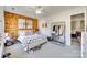 Bedroom with wood accent wall, large area rug, and a clothing rack with boots and shoes at 249 Sand Paver Way, Fort Mill, SC 29708