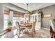 Elegant dining room featuring a round wood table and ample natural light at 249 Sand Paver Way, Fort Mill, SC 29708