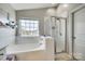 Relaxing main bathroom with a soaking tub and separate glass-enclosed shower at 249 Sand Paver Way, Fort Mill, SC 29708