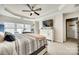 Serene main bedroom with tray ceiling, soft lighting, and a view of the outdoors at 249 Sand Paver Way, Fort Mill, SC 29708