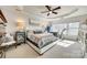 Bright main bedroom featuring tray ceiling, large windows, and comfortable furnishings at 249 Sand Paver Way, Fort Mill, SC 29708