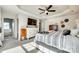 Well-lit main bedroom features ample closet space, TV, and modern decor at 249 Sand Paver Way, Fort Mill, SC 29708