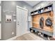 Mudroom featuring a wood bench, coat hooks, and shelving for storage at 249 Sand Paver Way, Fort Mill, SC 29708