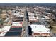A captivating aerial view of the city showcasing commercial buildings and vibrant city streets, with a water tower in the distance at 300 S Main St # K, Salisbury, NC 28144
