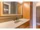 Bathroom vanity with granite countertops, ample storage and large mirror at 300 S Main St # K, Salisbury, NC 28144