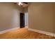 A adaptable bedroom showcasing hardwood floors and a practical layout, enhanced by neutral walls at 300 S Main St # K, Salisbury, NC 28144