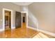 Bedroom with hardwood floors and three dark doors at 300 S Main St # K, Salisbury, NC 28144