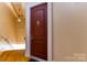 Apartment entryway featuring hardwood floors and a secure door with the letter K at 300 S Main St # K, Salisbury, NC 28144