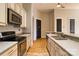 Kitchen featuring stainless steel appliances, granite countertops, and hardwood floors at 300 S Main St # K, Salisbury, NC 28144