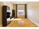 Well-lit living room with hardwood floors and built-in shelving at 300 S Main St # K, Salisbury, NC 28144