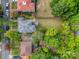 An aerial view of a home surrounded by mature trees and a large backyard at 306 W Marsh St, Salisbury, NC 28144