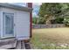 The backyard features a wooden fence surrounding the yard with a door leading to the house at 306 W Marsh St, Salisbury, NC 28144