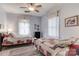 Shared bedroom featuring twin beds, colorful quilts, and bright natural light at 306 W Marsh St, Salisbury, NC 28144