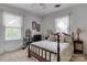 Inviting bedroom featuring neutral tones, a ceiling fan, and ample natural light at 306 W Marsh St, Salisbury, NC 28144