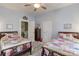 Charming bedroom featuring twin beds with colorful patchwork quilts and light blue walls at 306 W Marsh St, Salisbury, NC 28144