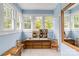 Sunlit room with multiple windows and a dollhouse on a dresser at 306 W Marsh St, Salisbury, NC 28144
