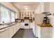 Functional kitchen with ample cabinet space, white appliances, and a vintage charm at 306 W Marsh St, Salisbury, NC 28144