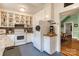 Functional kitchen with white appliances, ample cabinet space, and an adjacent dining area at 306 W Marsh St, Salisbury, NC 28144