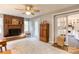 Cozy living room with a brick fireplace, wood cabinet, and a glimpse into the kitchen at 306 W Marsh St, Salisbury, NC 28144
