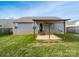 The backyard featuring a covered porch and a flat grassy area at 313 Pelling Dr, York, SC 29745