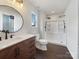 Modern bathroom featuring a spacious shower, sleek vanity, stylish fixtures, and great natural light at 313 Pelling Dr, York, SC 29745