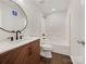 Bathroom with a modern vanity, round mirror, and a shower-tub combo at 313 Pelling Dr, York, SC 29745