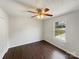 Bedroom with hardwood floors, a ceiling fan, and a bright window overlooking the yard at 313 Pelling Dr, York, SC 29745