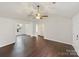 Bright living room featuring sleek wood floors, a ceiling fan, and neutral paint throughout at 313 Pelling Dr, York, SC 29745