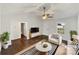 Bright, virtually staged living room with vaulted ceiling, modern furniture, and view to outside at 313 Pelling Dr, York, SC 29745