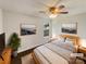 Virtually staged main bedroom with wood-look floors, decor art, and large windows at 313 Pelling Dr, York, SC 29745