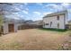 Expansive backyard features a storage shed, privacy fence, and ample space for outdoor activities at 3230 Richway Ct, Charlotte, NC 28216